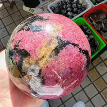 Load image into Gallery viewer, Natural Rhodonite Crystal Sphere – Polished Gemstone Ball for Collection &amp; Home Decor