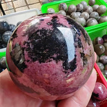 Load image into Gallery viewer, Natural Rhodonite Crystal Sphere – Polished Gemstone Ball for Collection &amp; Home Decor